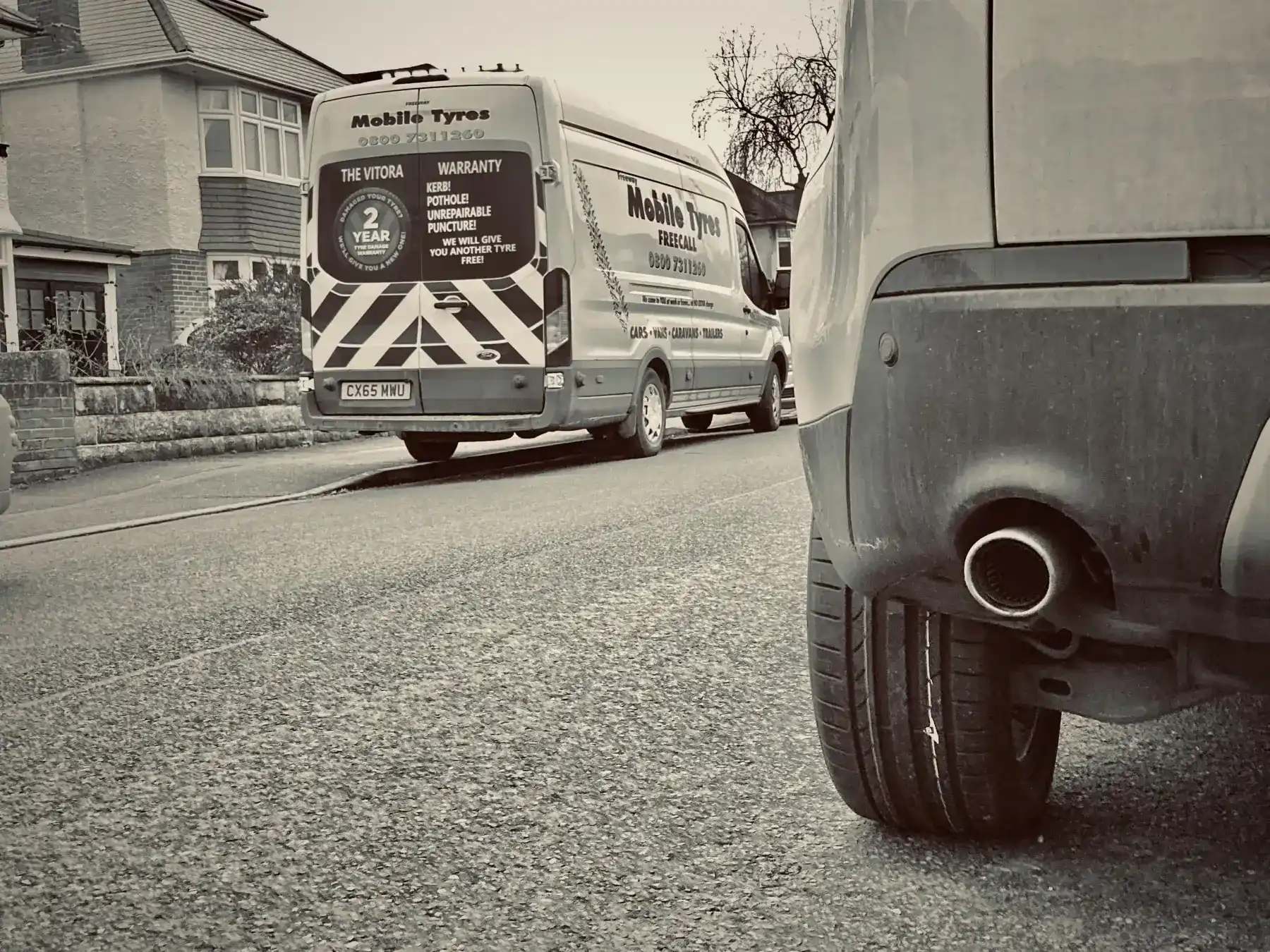 A Freeway Mobile Tyres technician fitting a tyre at the roadside in Dorset