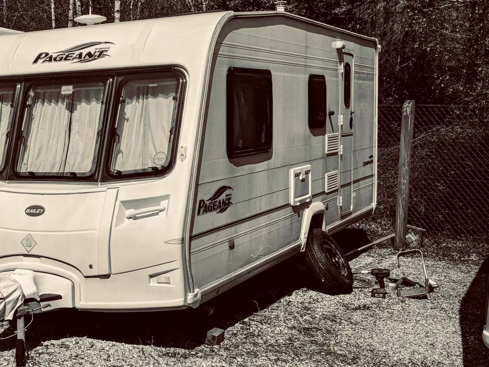 Caravan tyre being changed on site