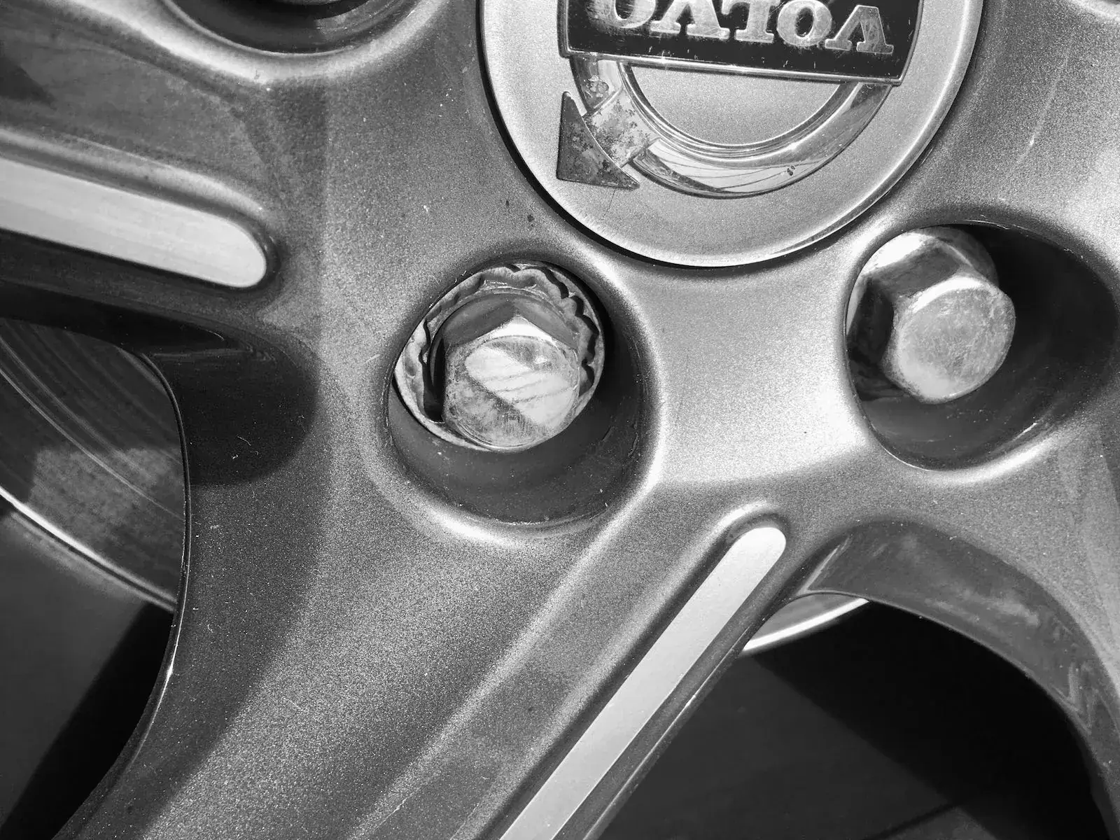 Close-up of a locking wheel nut on an alloy wheel