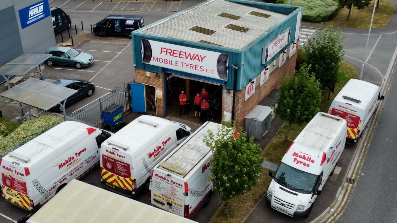 An overhead view of the Freeway Mobile Tyres depot with the vans parked outside.